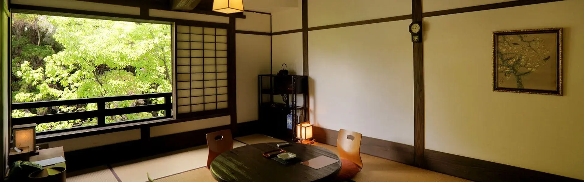 Tatami room at Fujiya with shoji screens and lush cedar forest framed in the window