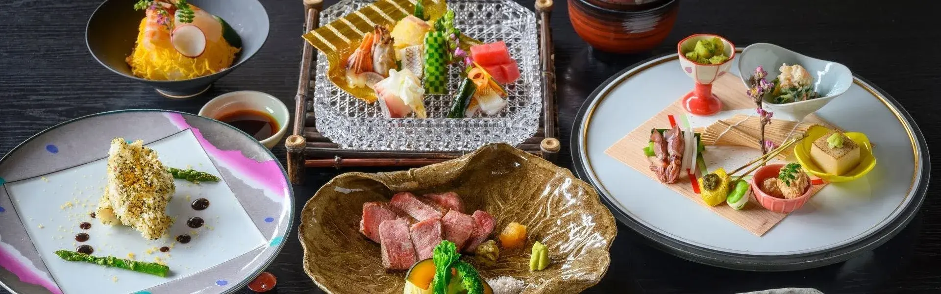 Kaiseki dinner spread with wagyu, sashimi, and seasonal courses at Ryokan Ohashi