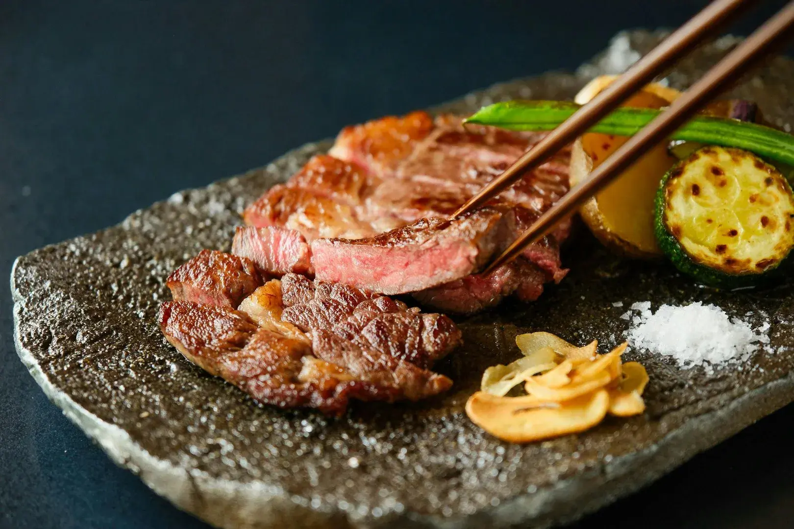 Wagyu beef sliced on stone with sea salt at Hatago Sakura's kaiseki dinner