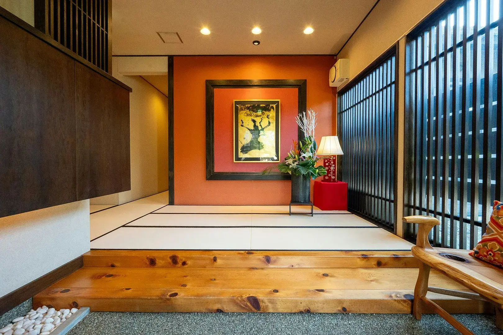 Tatami genkan with lacquered step, deer painting, and lattice screens at Kyuan Iida