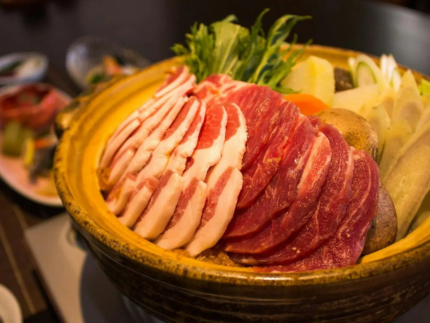 Wild boar and duck slices prepared for nabe hotpot at Ryokan Ichikawa