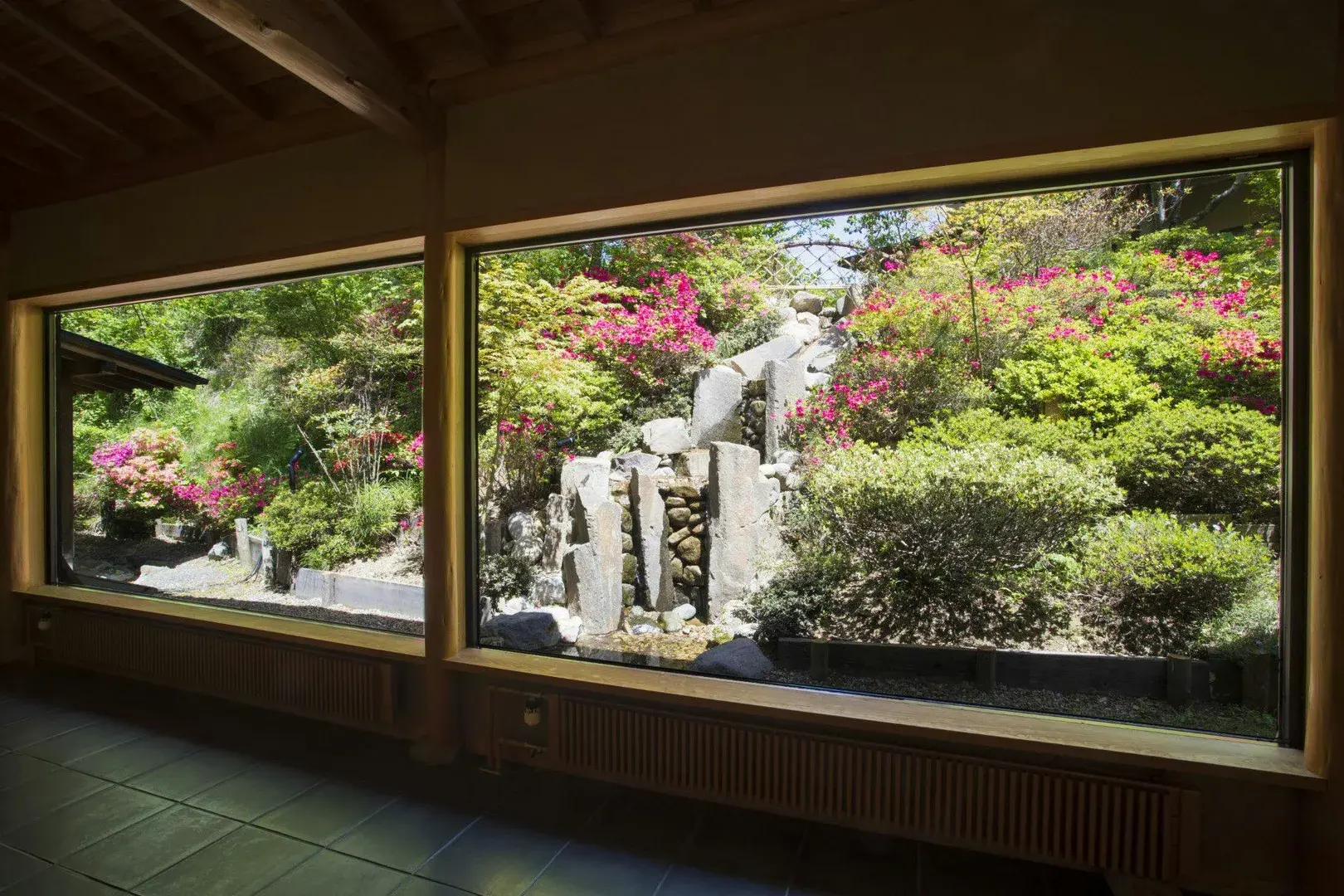 Azalea and rock garden seen through floor-to-ceiling windows in Bandai Atami