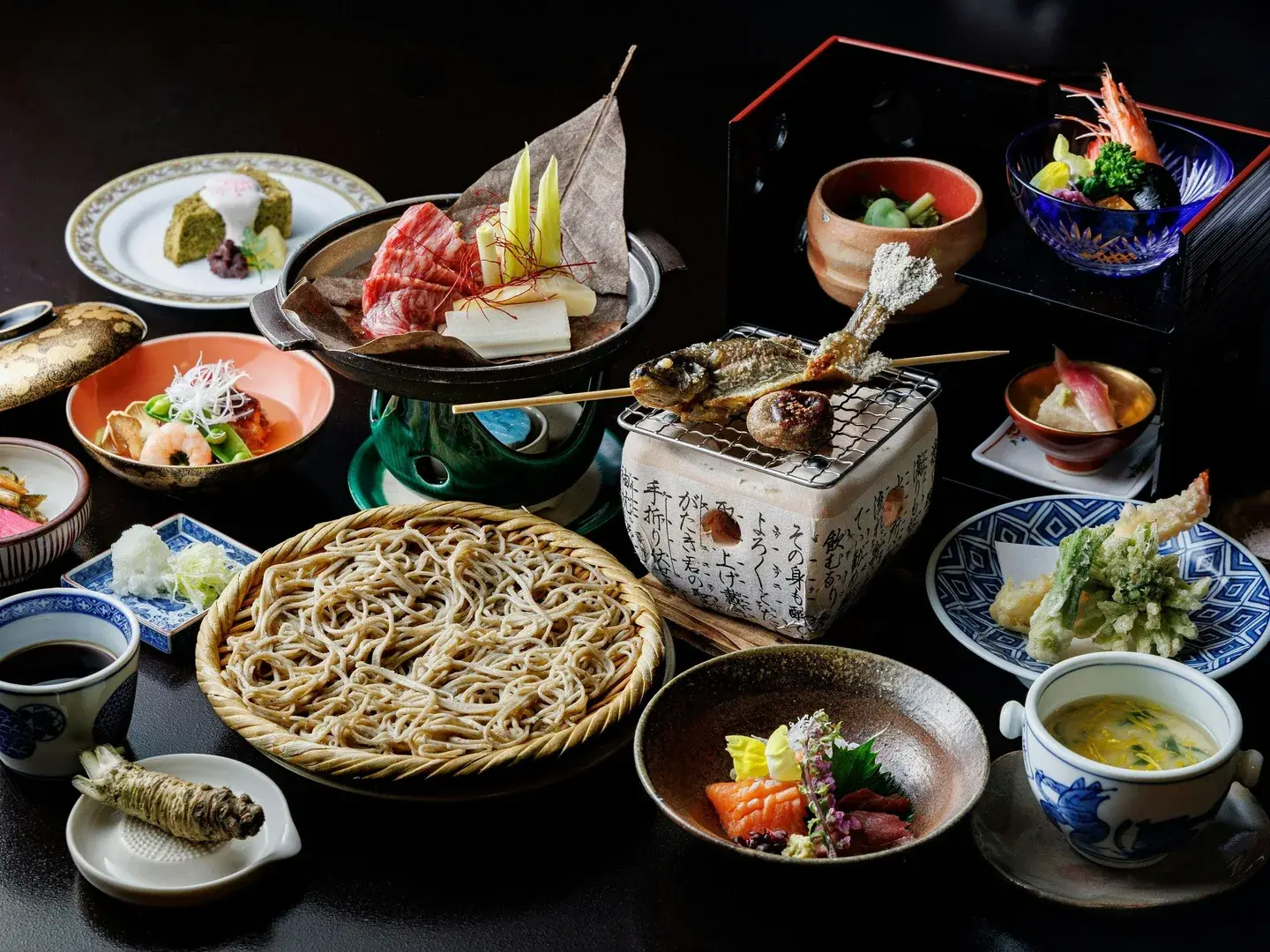 Fukashiso's kaiseki dinner spread with Shinshu soba, tempura, and grilled river fish