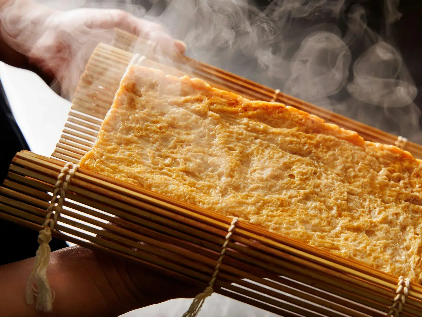 Steaming yuba lifted from a bamboo press at Fukashiso in Matsumoto