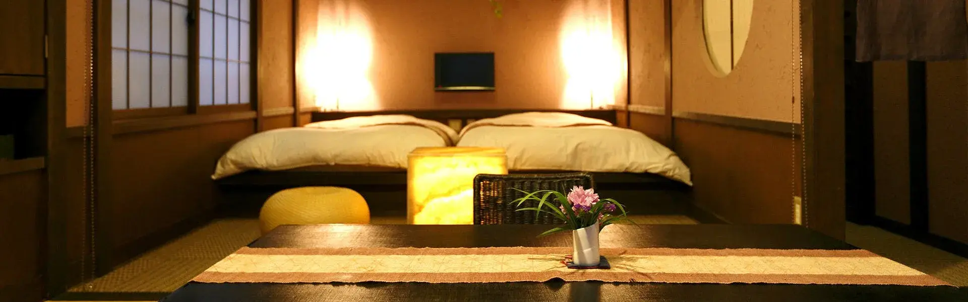 Tatami room at Wa no Takumi Hananorenn with low lacquer table and flower sprig