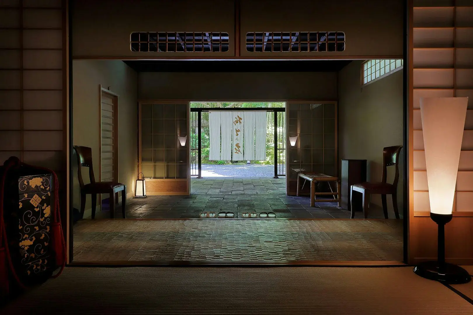 Yagyu no Sho genkan entrance, stone floor and noren curtain framing bamboo grove