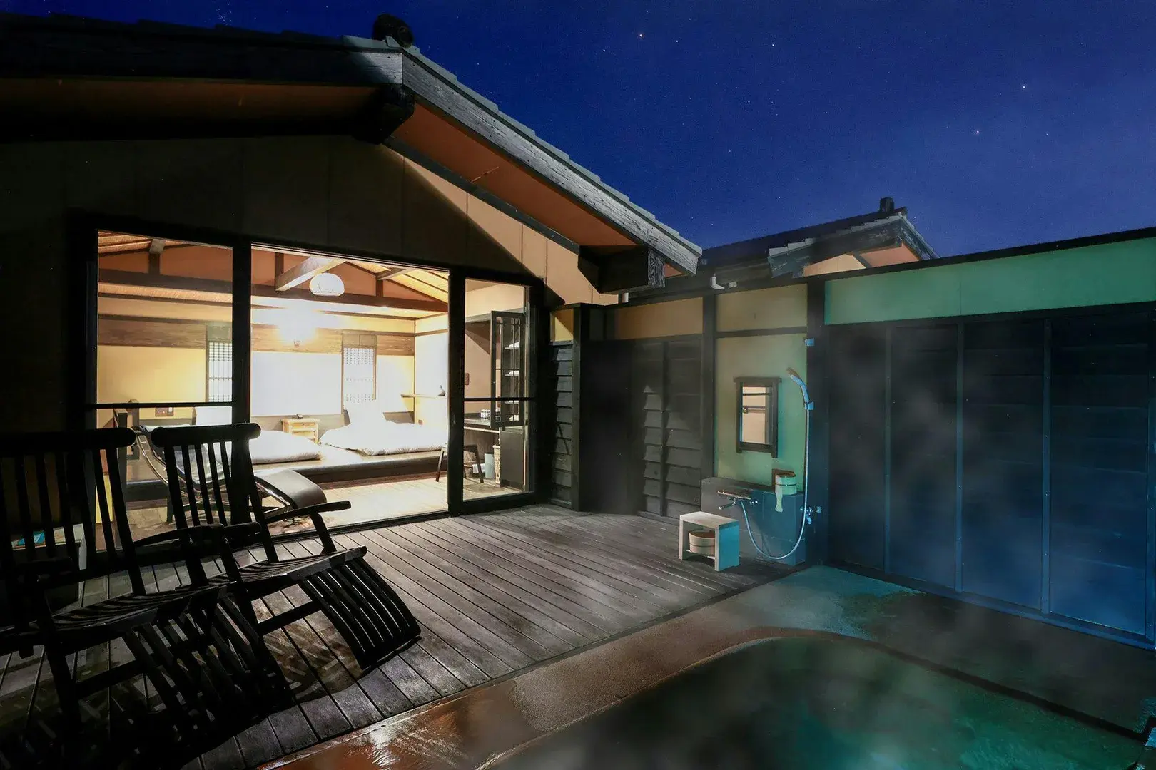 Private rotenburo steaming under a starry night sky at Oyado Uchiyama in Izu Kogen