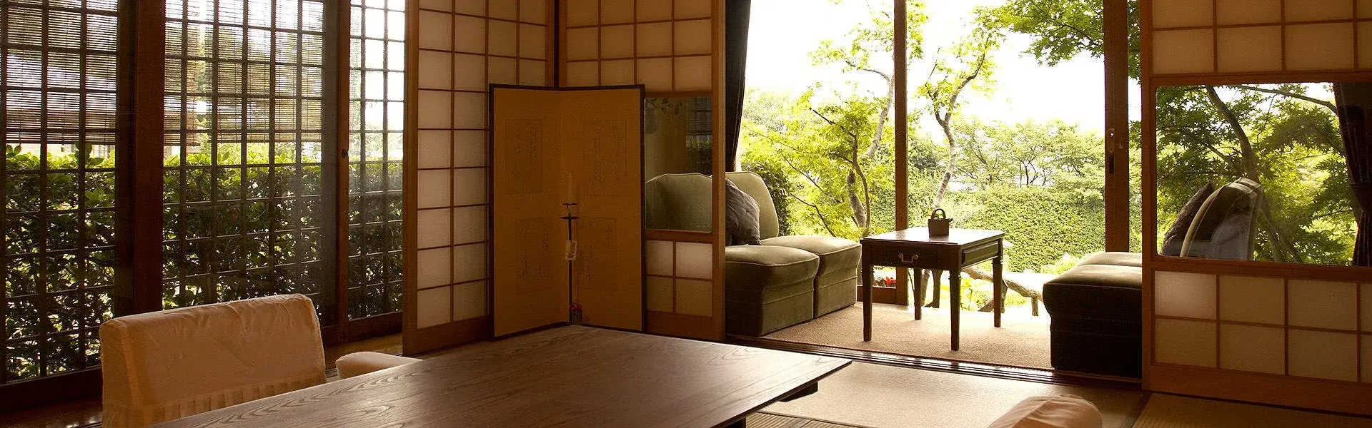 Sekitei tatami room with shoji screens opening onto summer garden foliage
