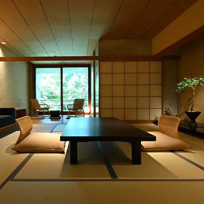 Tatami room with low lacquer table and shoji screens at Beniya Mukayu, Yamashiro Onsen