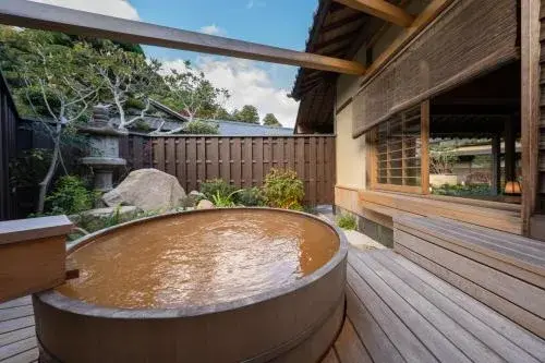 Private rotenburo with iron-rich kinsen water at Tocen Goshoboh in Arima Onsen
