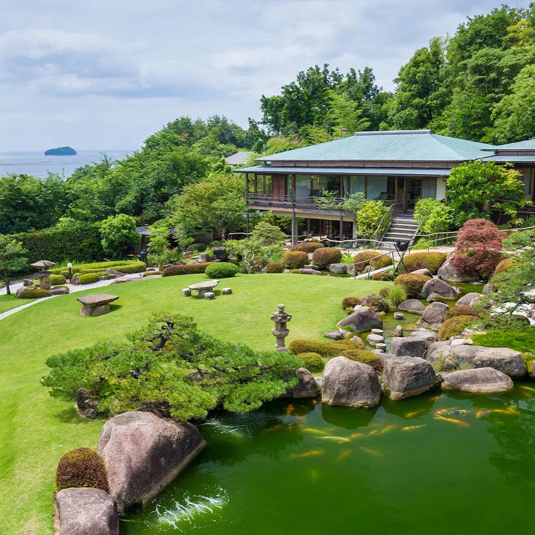 Sekitei's stone and koi pond garden descending toward the Seto Inland Sea