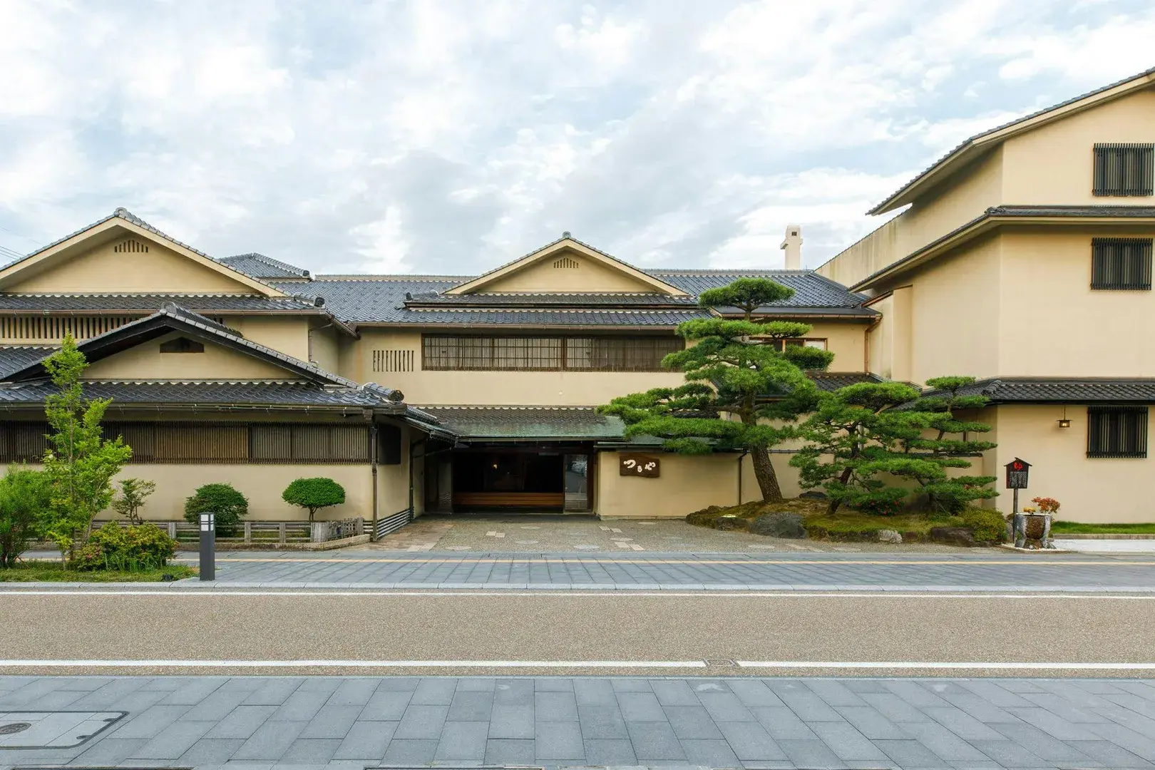 Tsuruya's entrance facade with pine-trimmed porte-cochere in Awara Onsen, Fukui