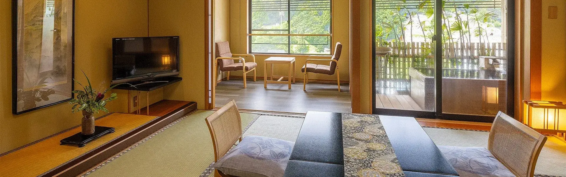 Kasenkyo Izutsuya tatami room with veranda opening to summer forest