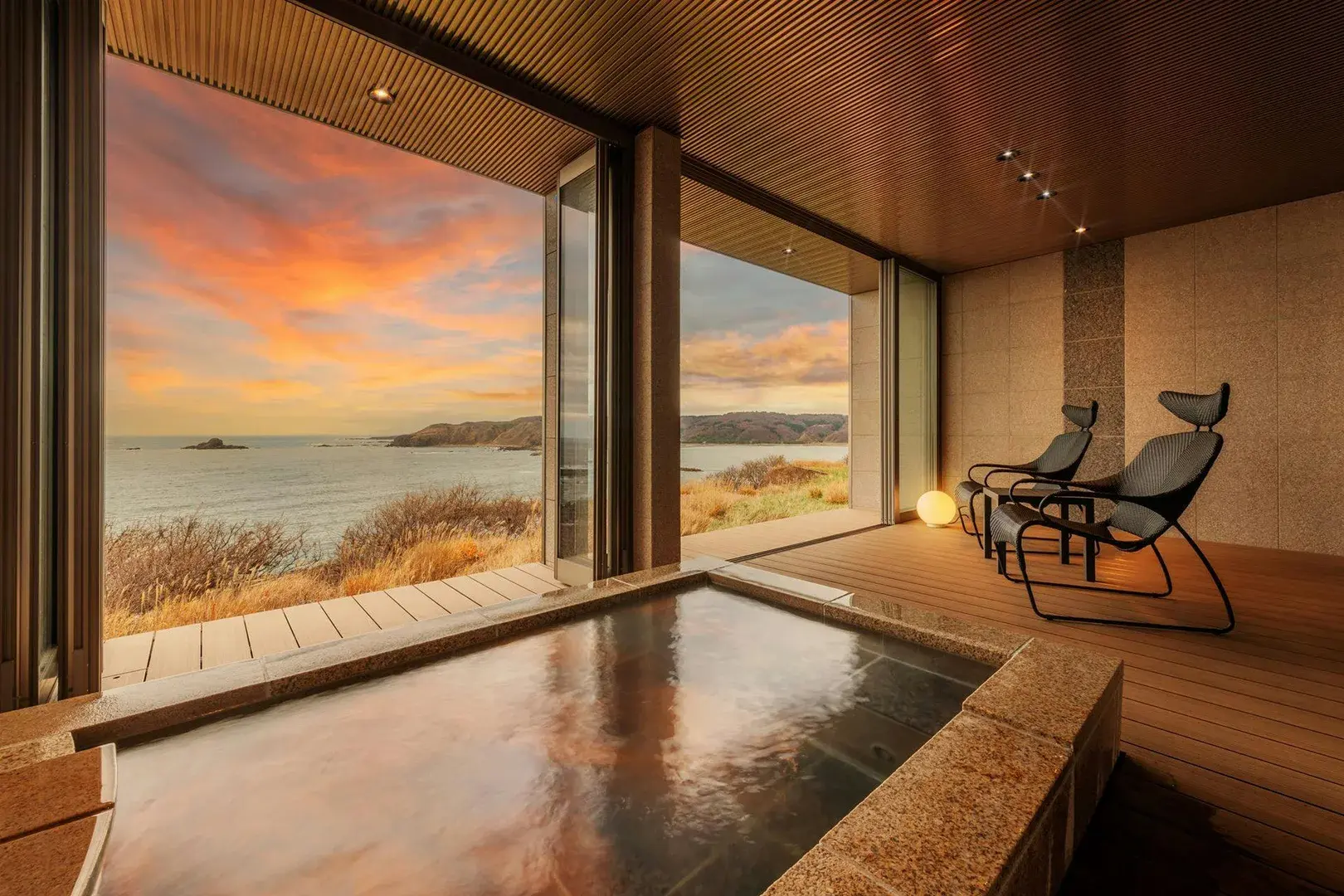 Private in-room onsen bath at Teisui facing a Sea of Japan sunset